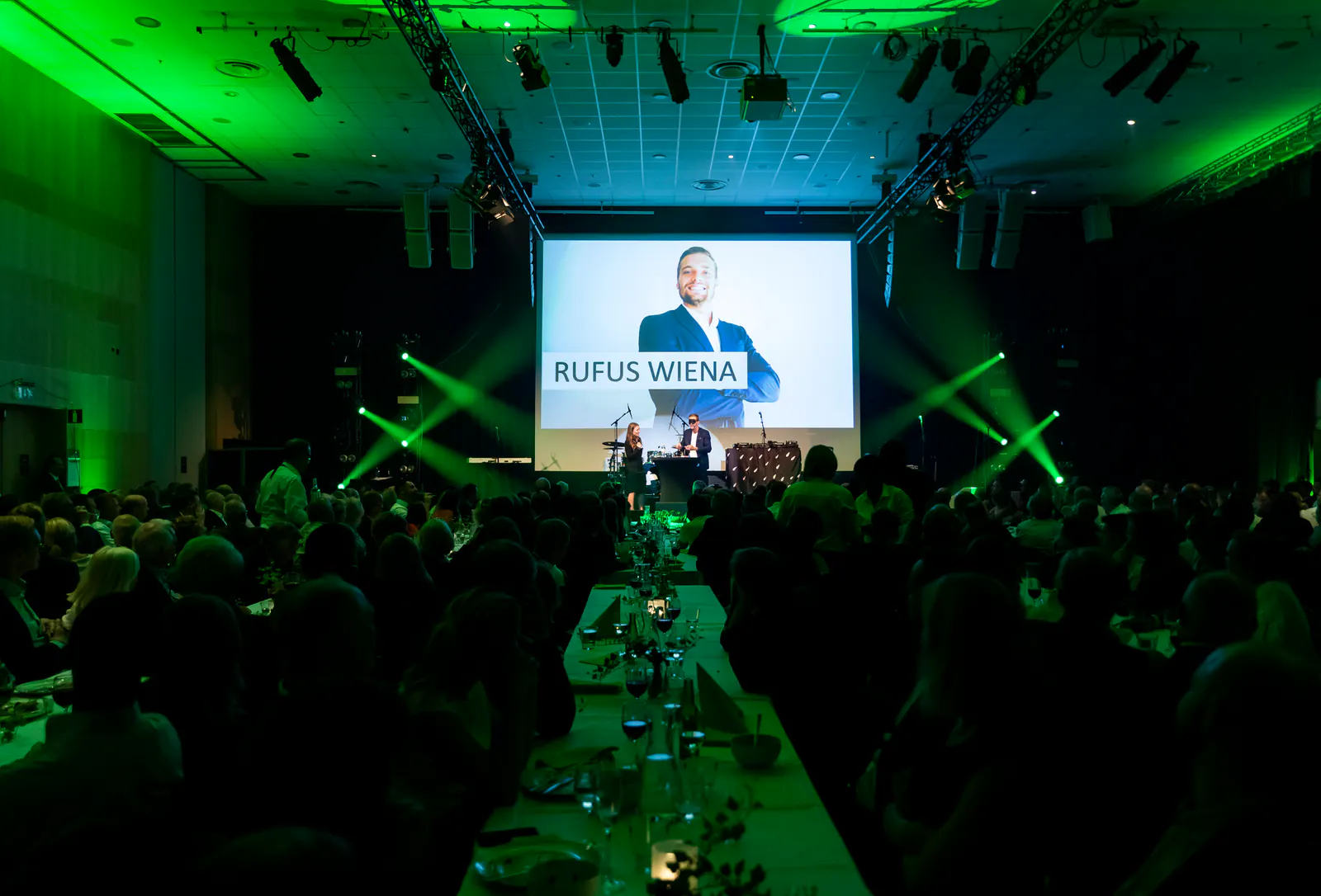Rufus Wiena presenting on stage