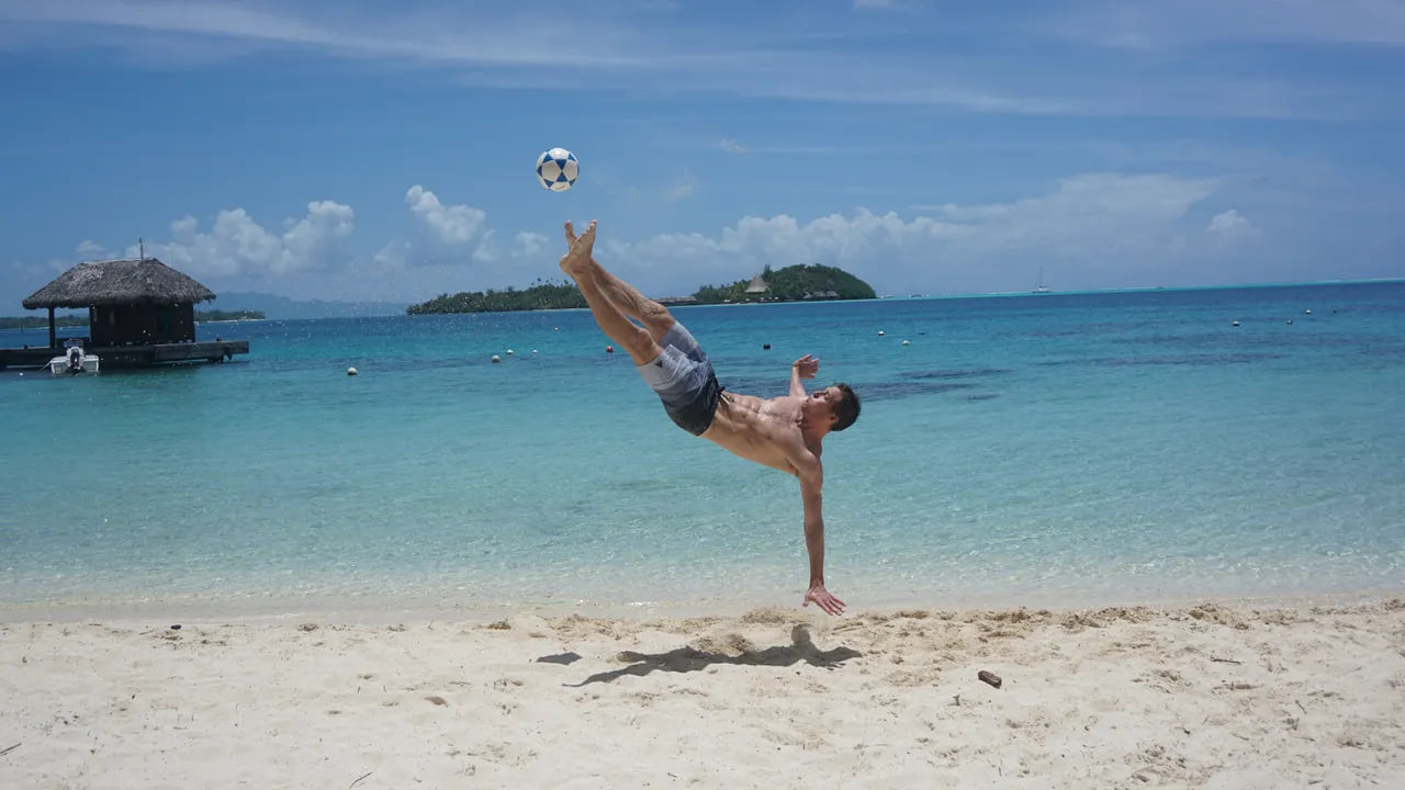 Rufus playing Footvolley on a tropical beach in Bora Bora