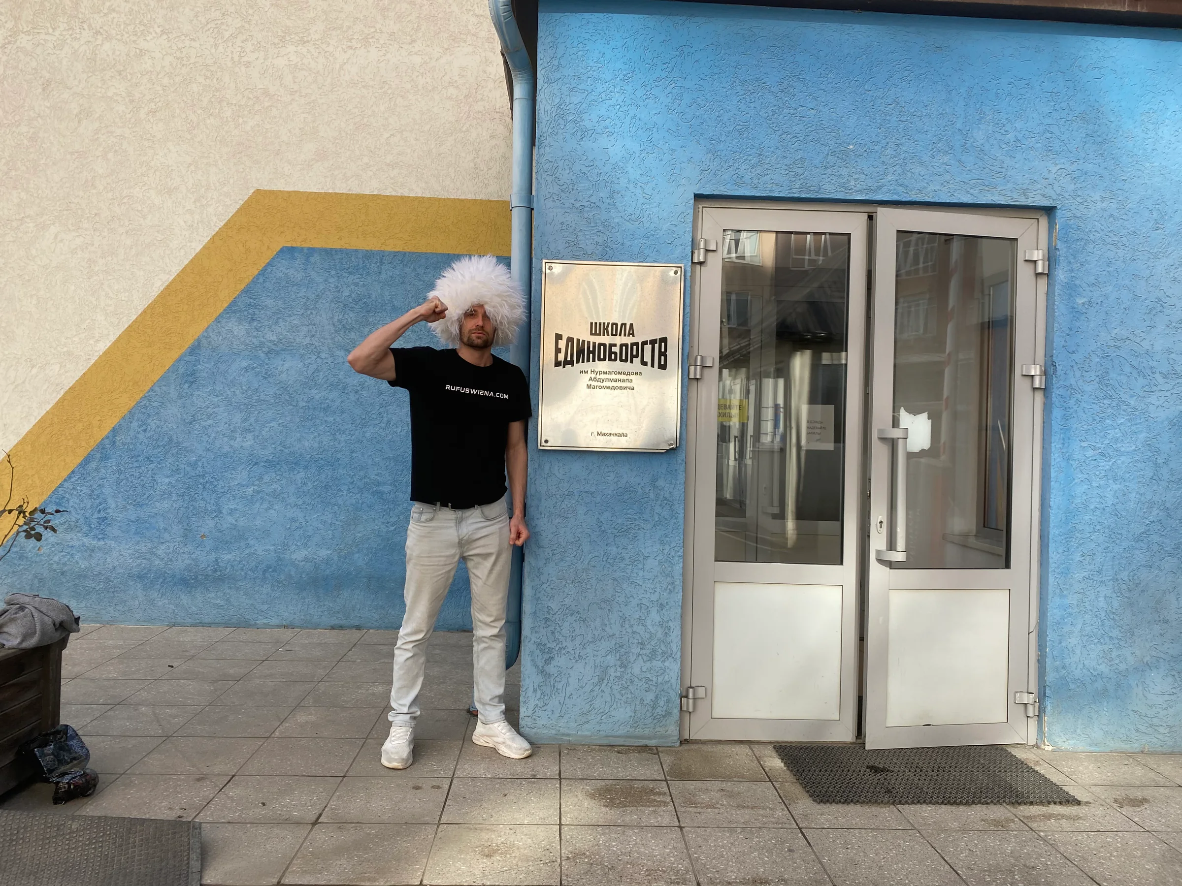 Rufus Wiena wearing a papakha outside Khabib Nurmagomedov's gym in Makhachkala